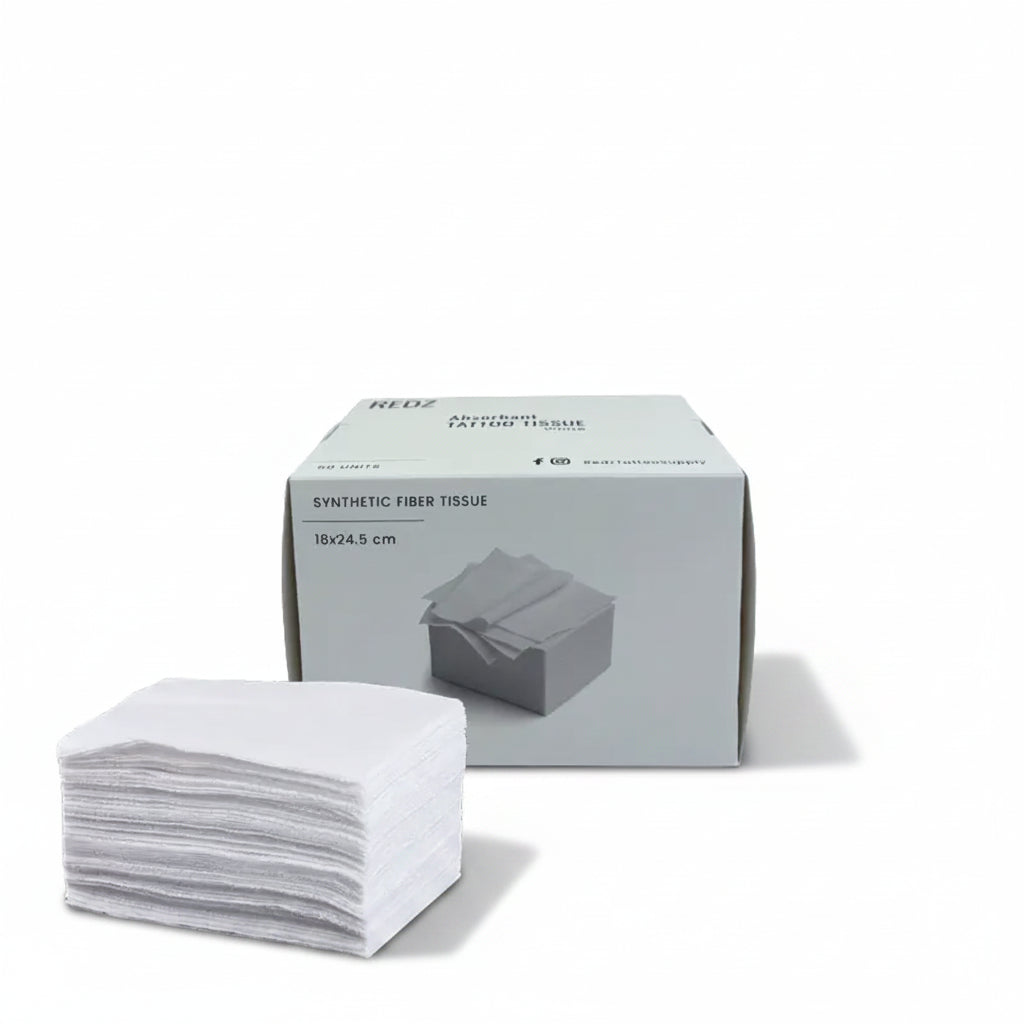 A stack of white synthetic fiber tissue pads placed in front of their light gray retail box on a plain white background.